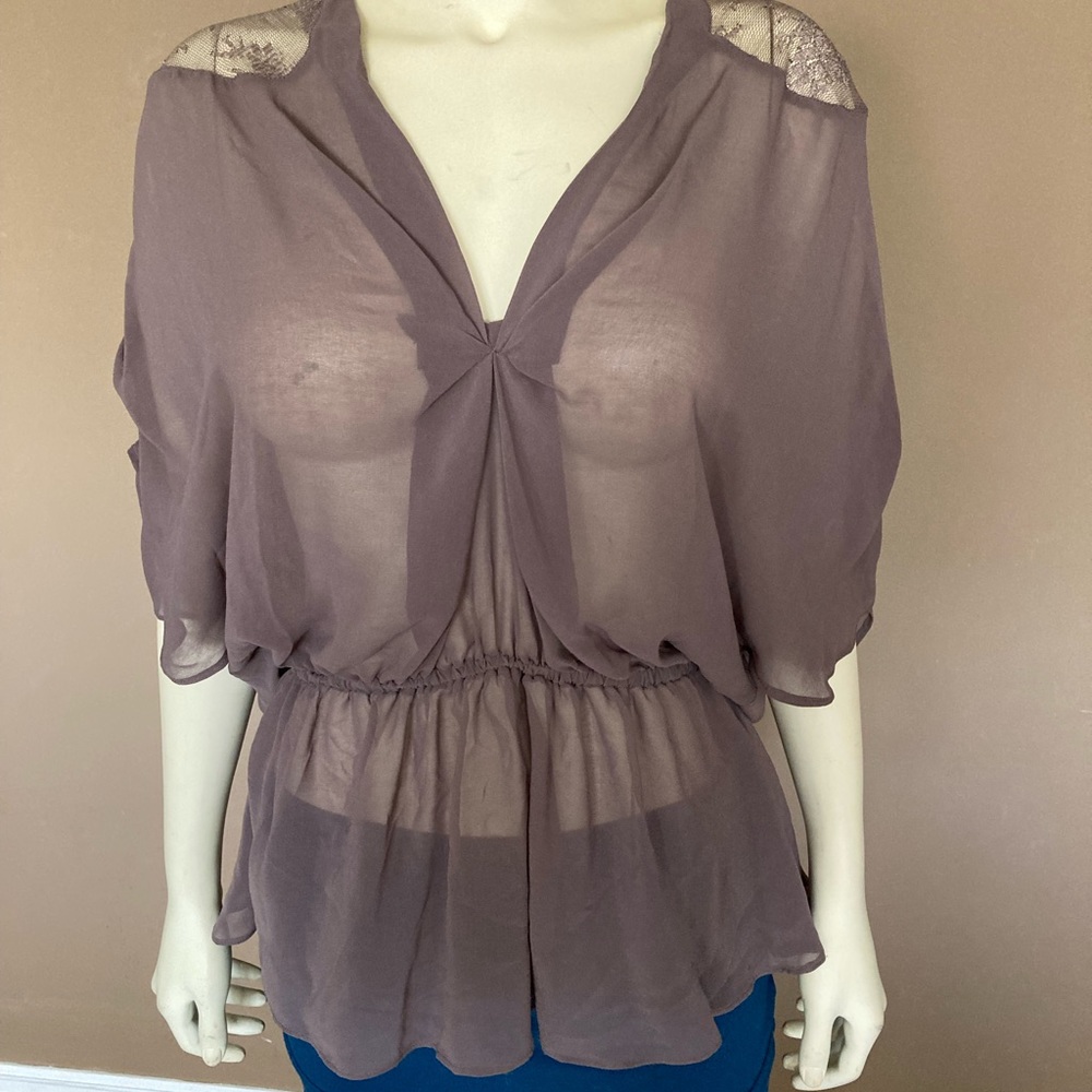 Blouse with lace trim on shoulders (see through)